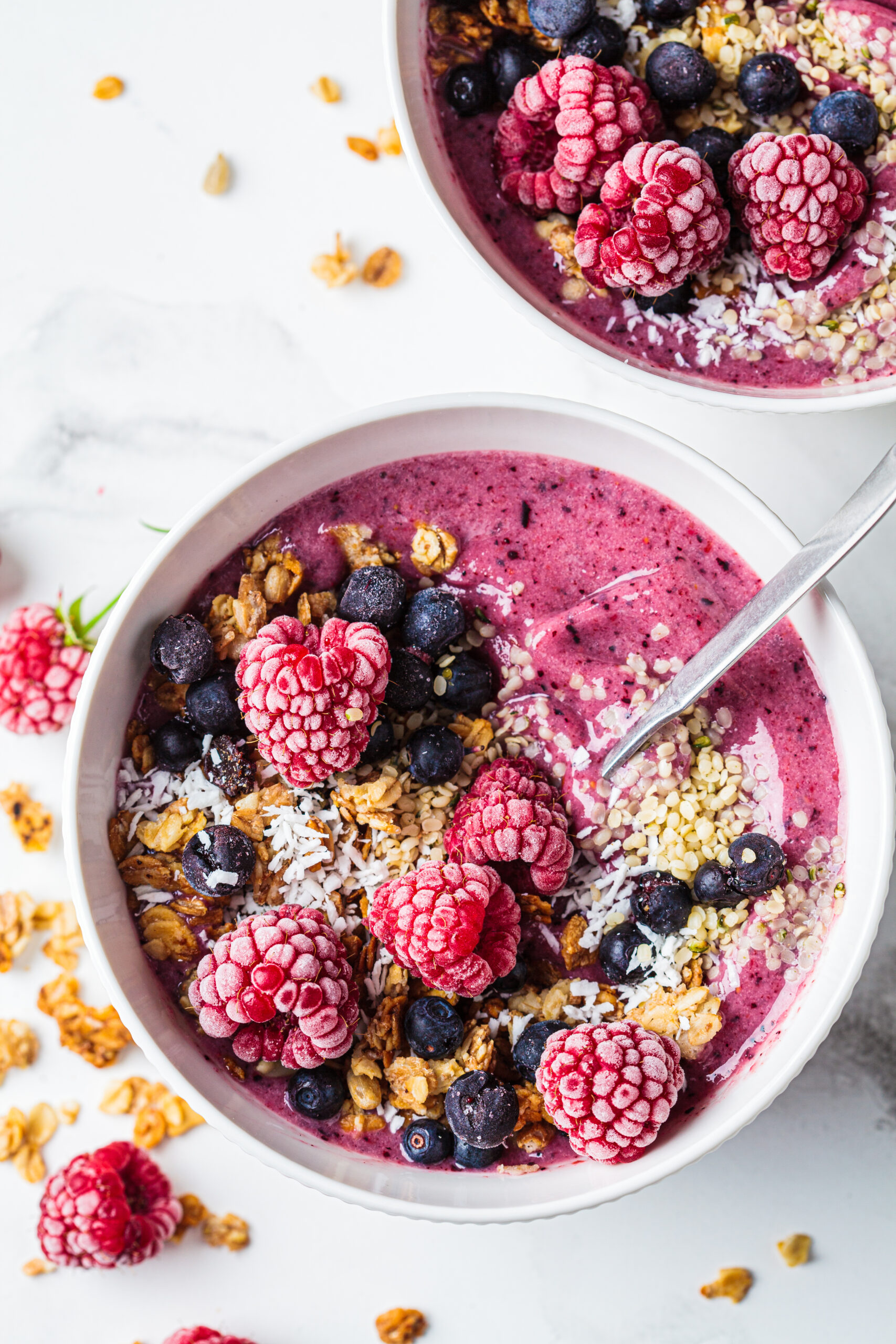 Berry smoothie bowl with granola, coconut and hemp seeds, marble